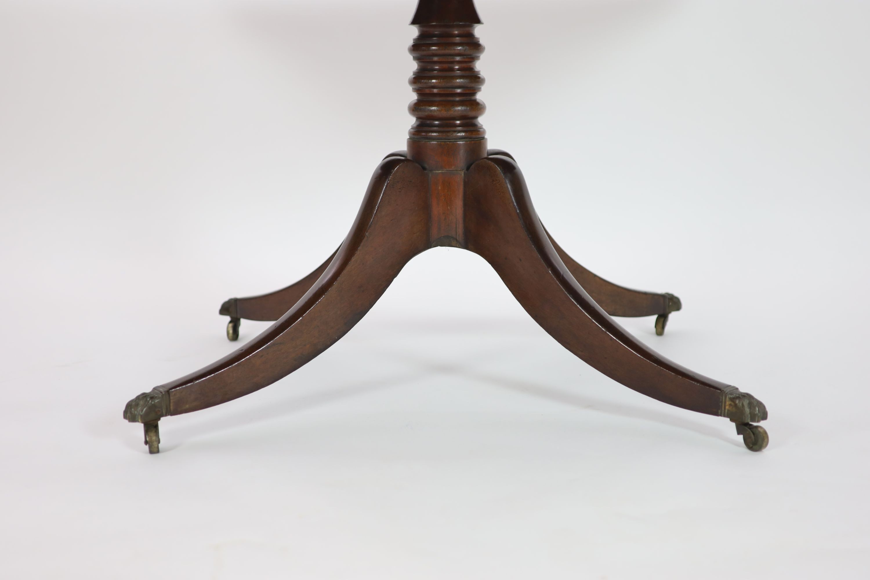 A Regency rectangular mahogany tilt top dining table, width 130cm, depth 80cm, height 72cm